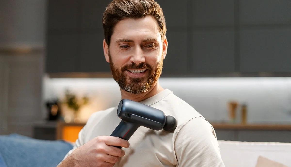 man using massage gun