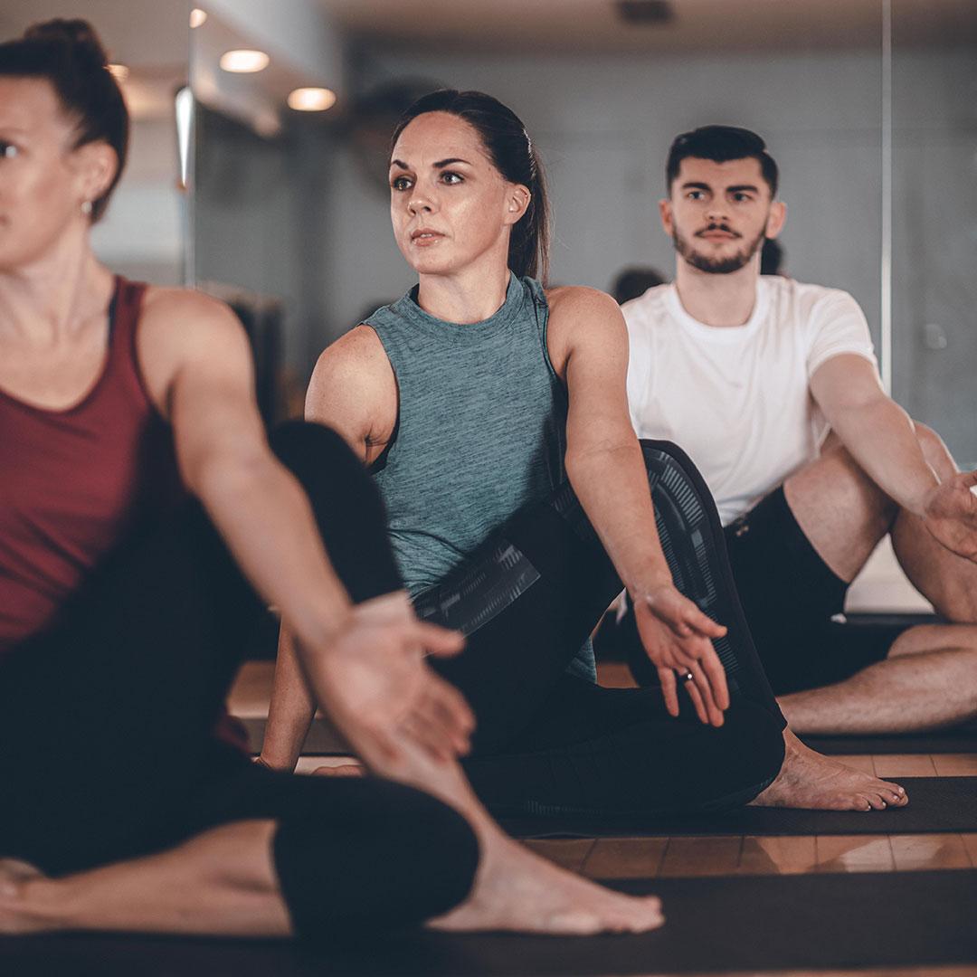 woman sitting in a yoga class